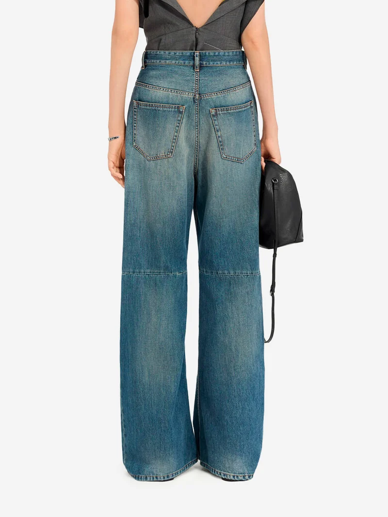 Jeans gamba larga con interruzioni visibili