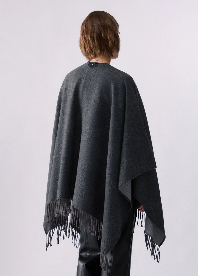 Poncho with embossed logo