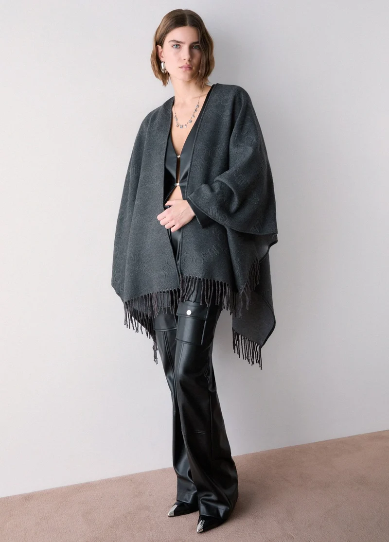 Poncho with embossed logo