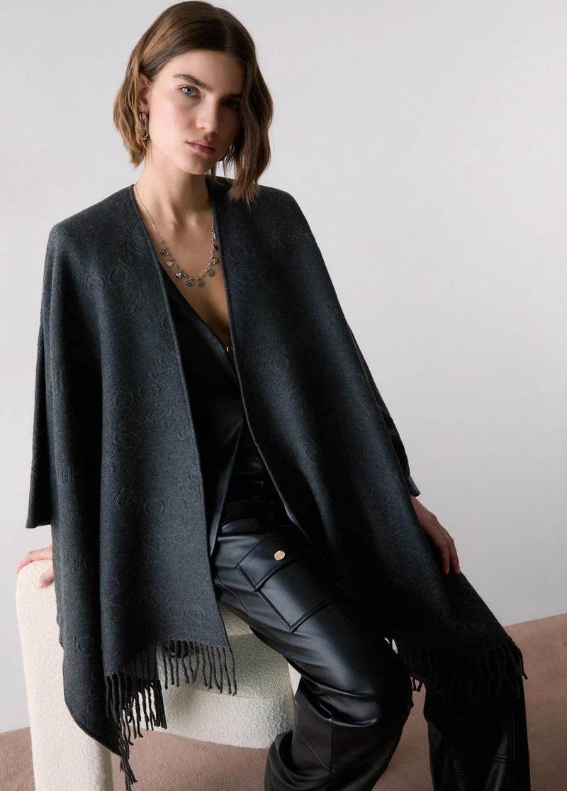 Poncho with embossed logo