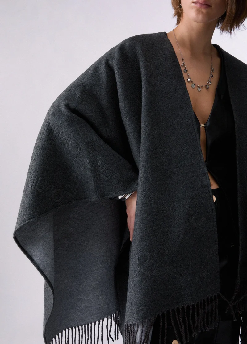 Poncho with embossed logo