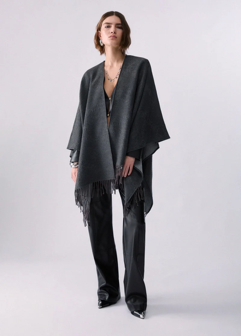 Poncho with embossed logo