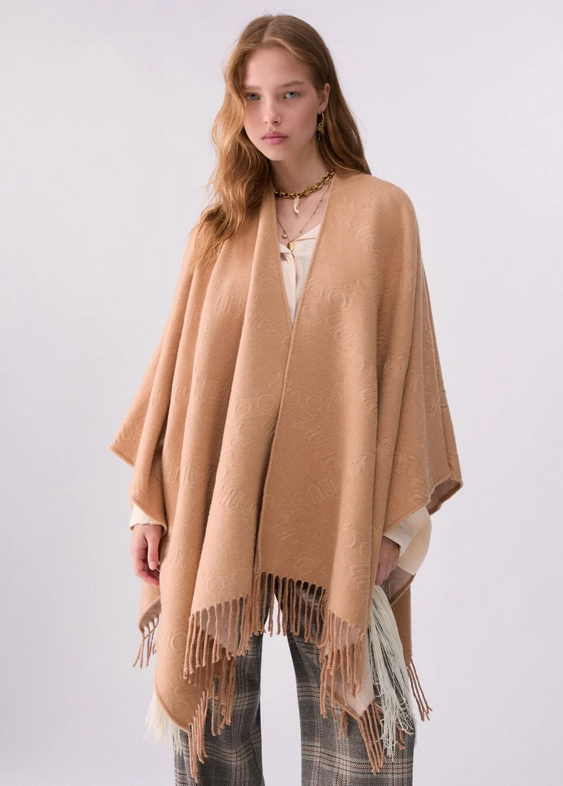 Poncho with embossed logo