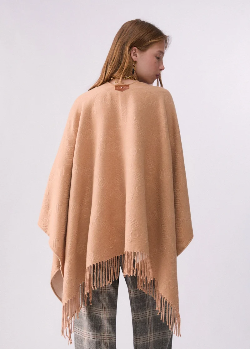 Poncho with embossed logo