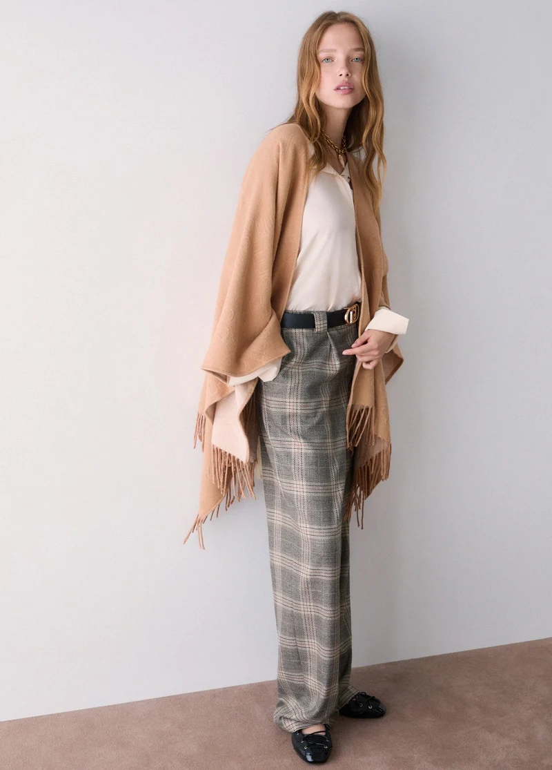 Poncho with embossed logo