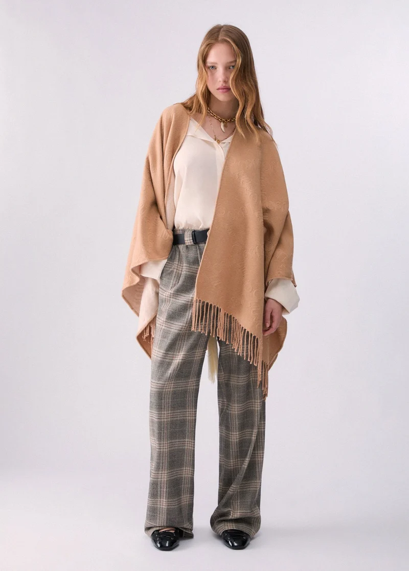Poncho with embossed logo