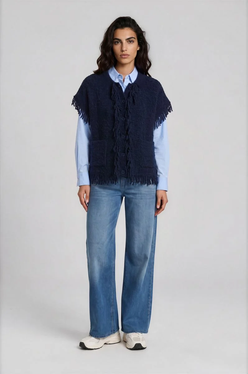 sleeveless roundneck vest with raveled thread on sleeve, neck