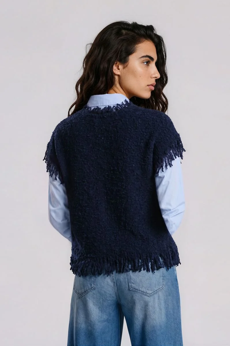 sleeveless roundneck vest with raveled thread on sleeve, neck