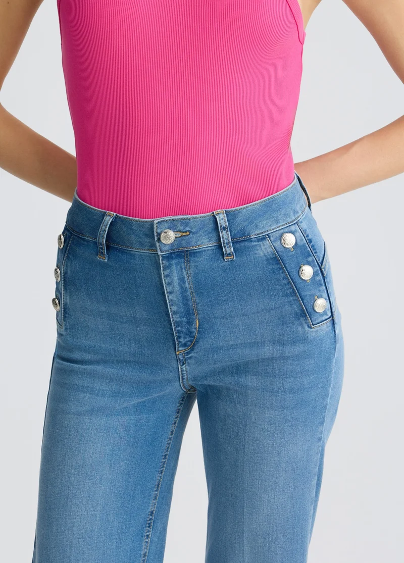 Flared jeans with buttons