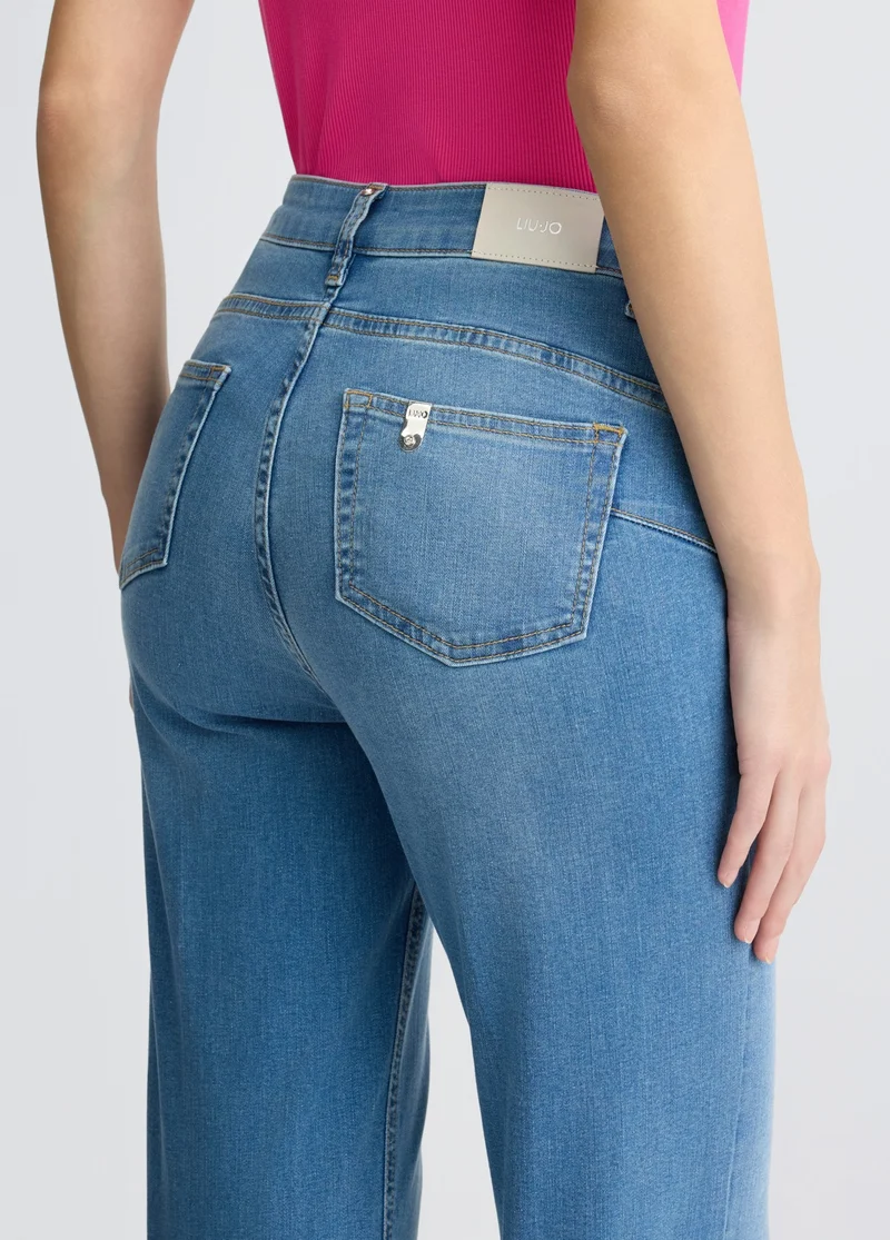 Flared jeans with buttons