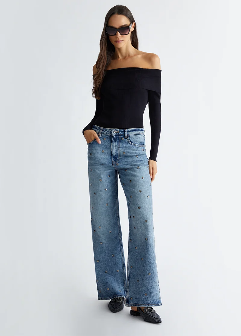 Flared jeans with studs