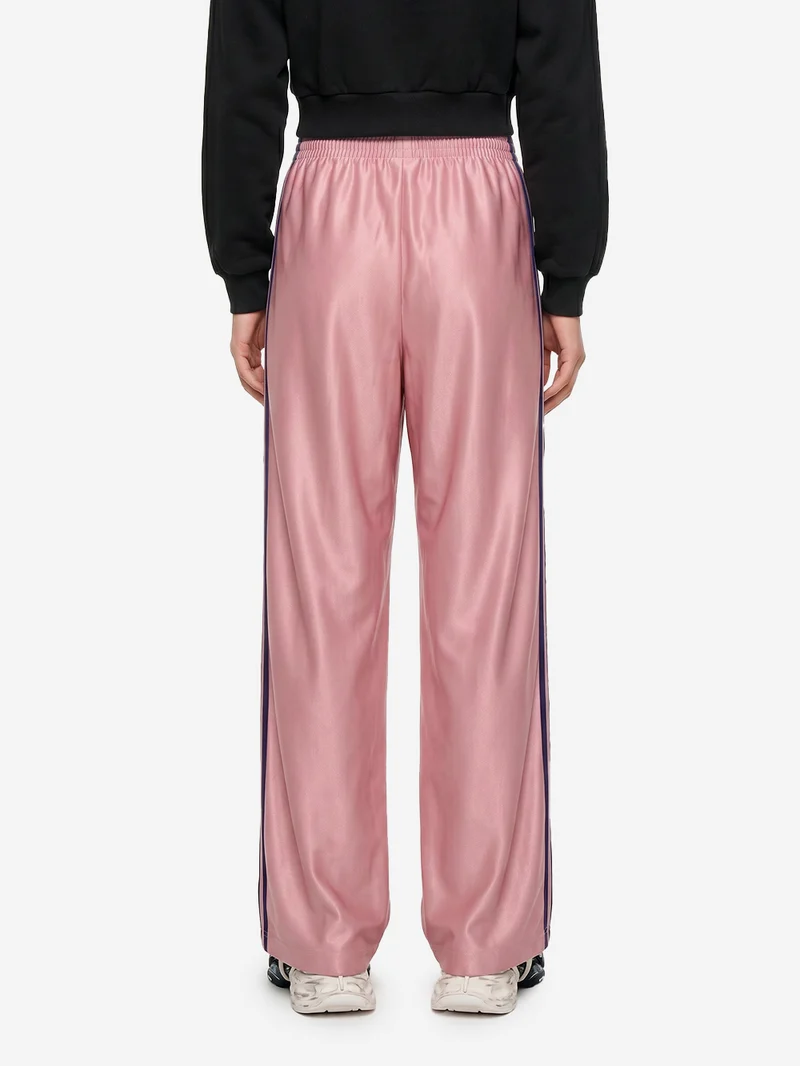 Pantaloni loose 'Firebird' rosa con stripes nere