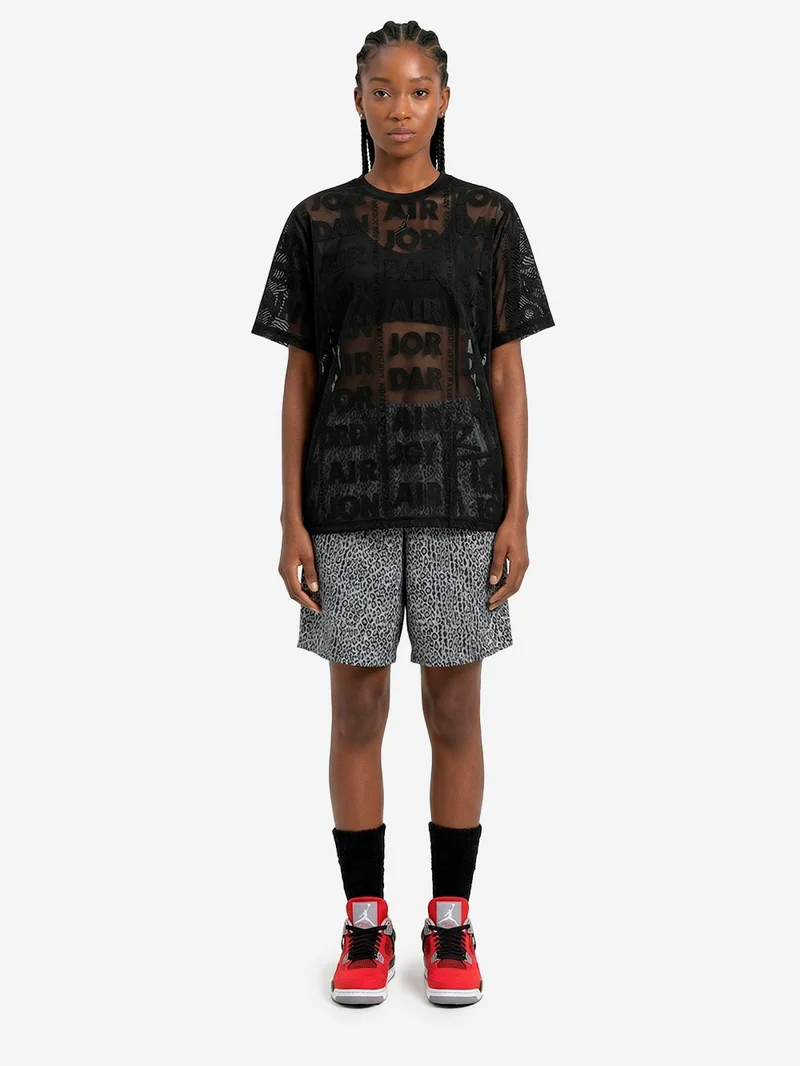 Top nero in maglia a trama larga con trasparenze