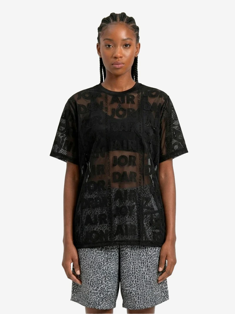 Top nero in maglia a trama larga con trasparenze