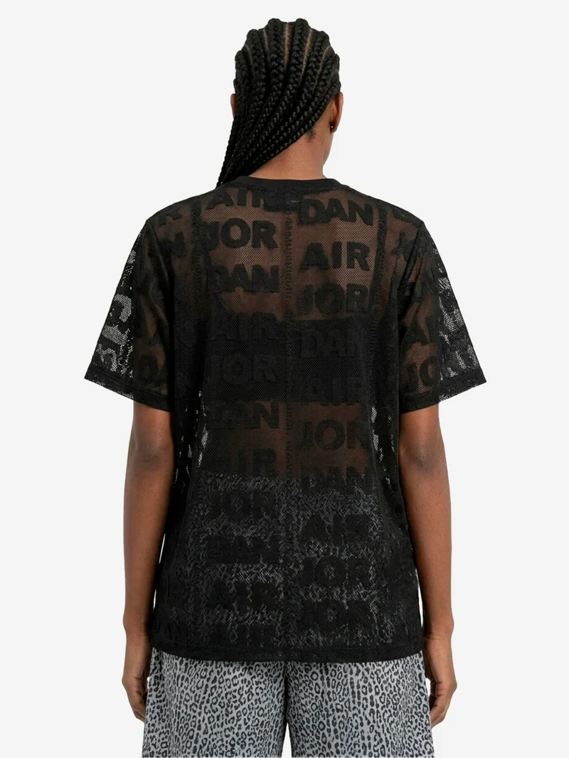 Top nero in maglia a trama larga con trasparenze