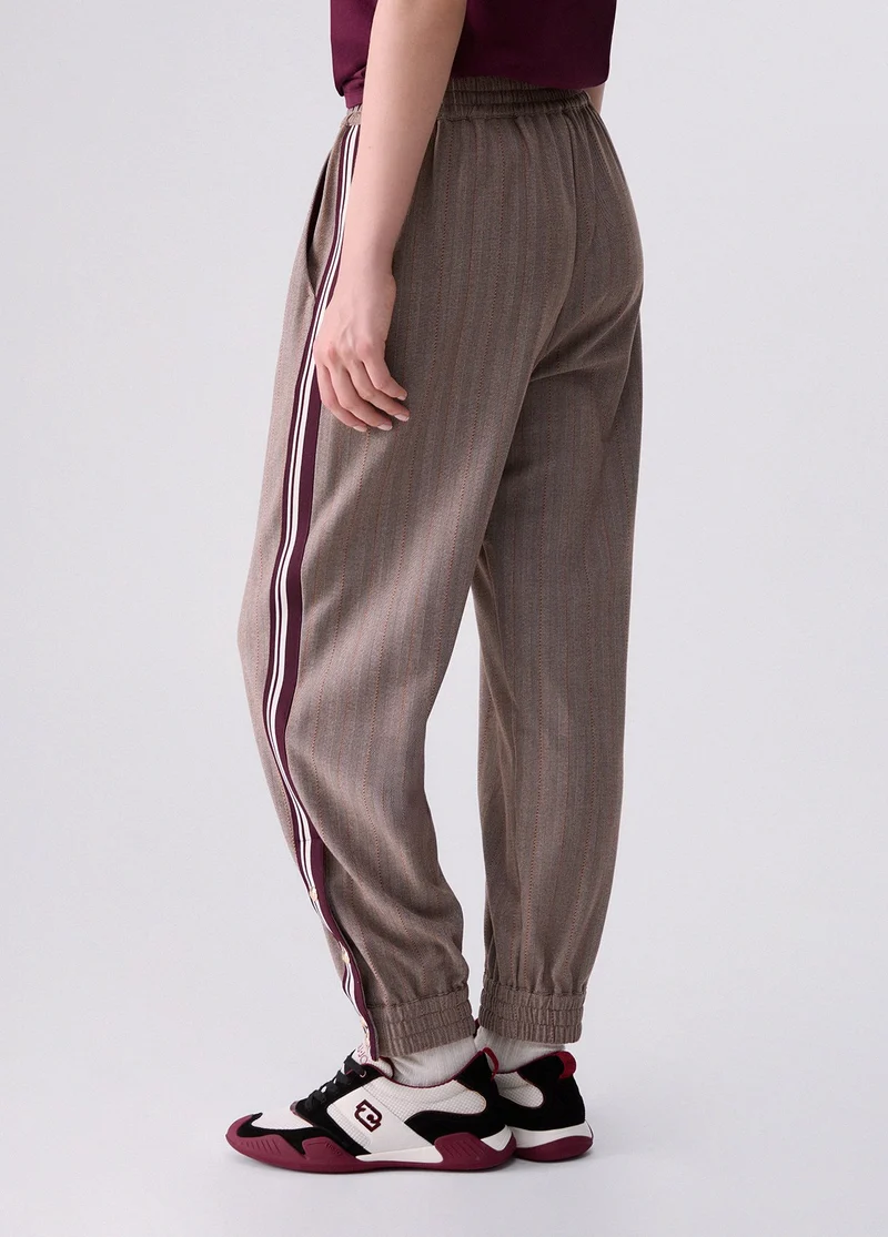 Jogging pants with side tape
