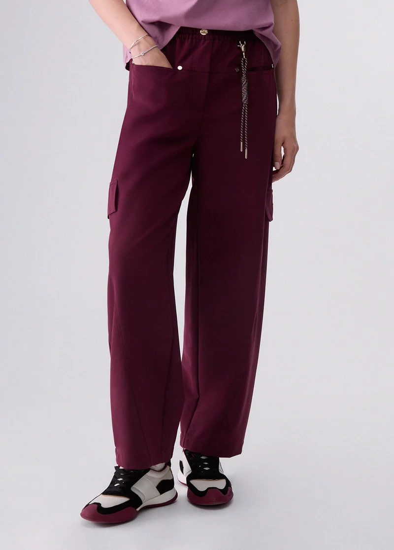 Oversized trousers with charm