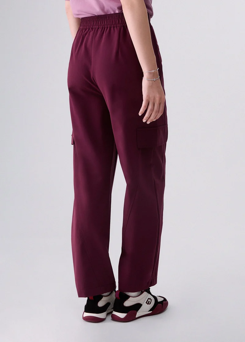 Oversized trousers with charm