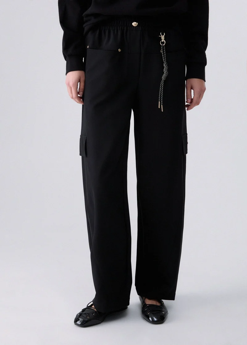 Oversized trousers with charm