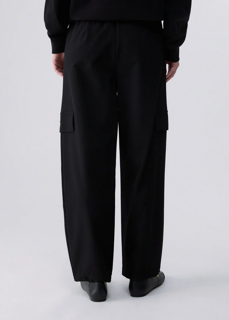 Oversized trousers with charm