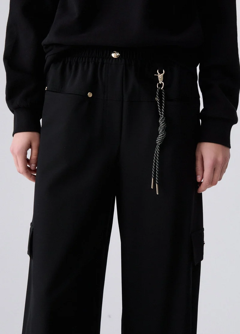 Oversized trousers with charm