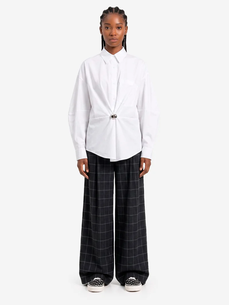 Pantaloni a quadri con cucitura ritorta