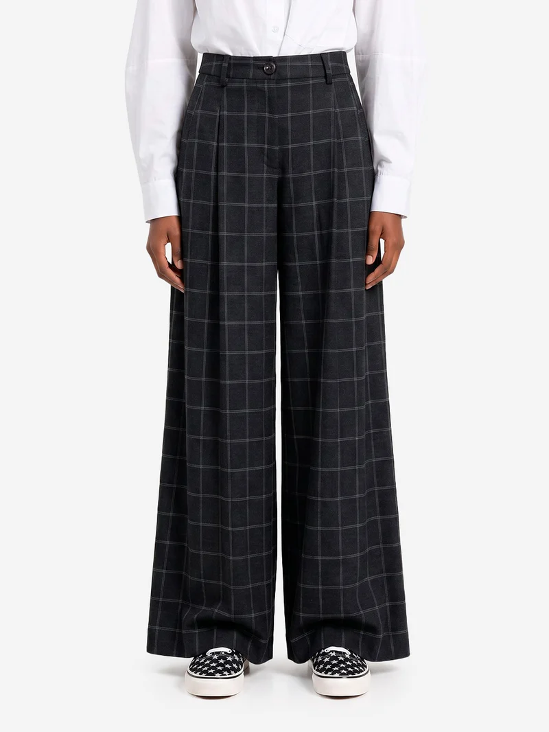 Pantaloni a quadri con cucitura ritorta