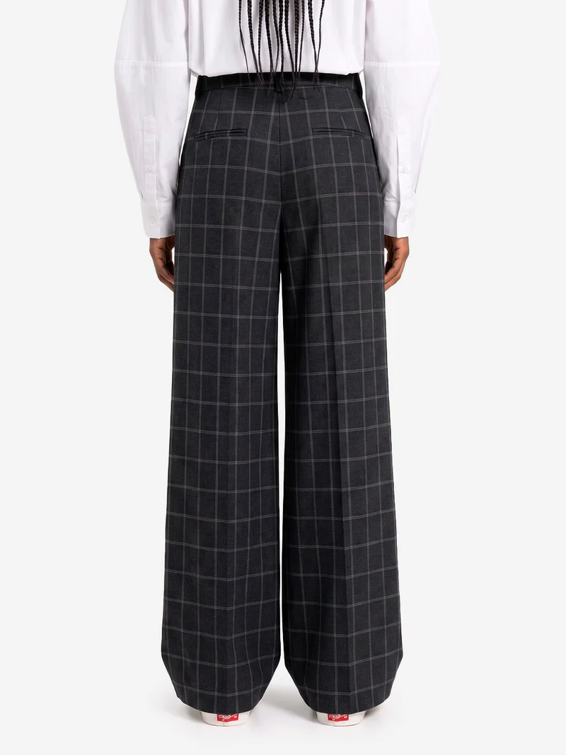 Pantaloni a quadri con cucitura ritorta