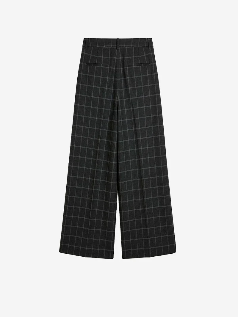 Pantaloni a quadri con cucitura ritorta