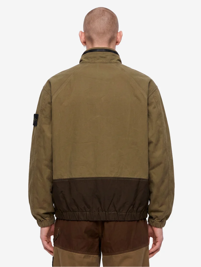 Giacca verde militare in cotone con inserti in nylon e logo patch