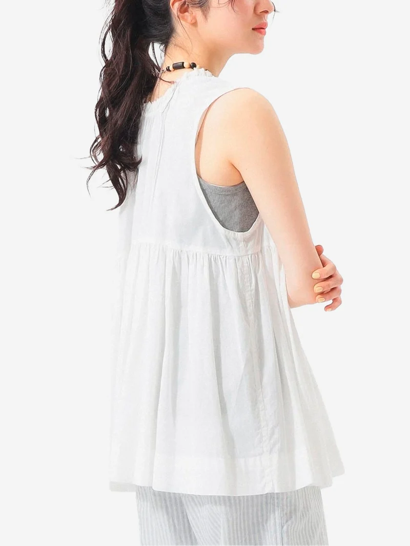 Camicia senza maniche bianca in sheer di cotone con lacci e pieghe