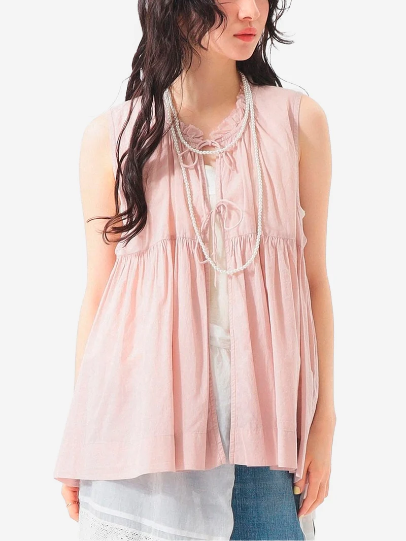 Camicia senza maniche rosa in sheer di cotone con lacci e pieghe