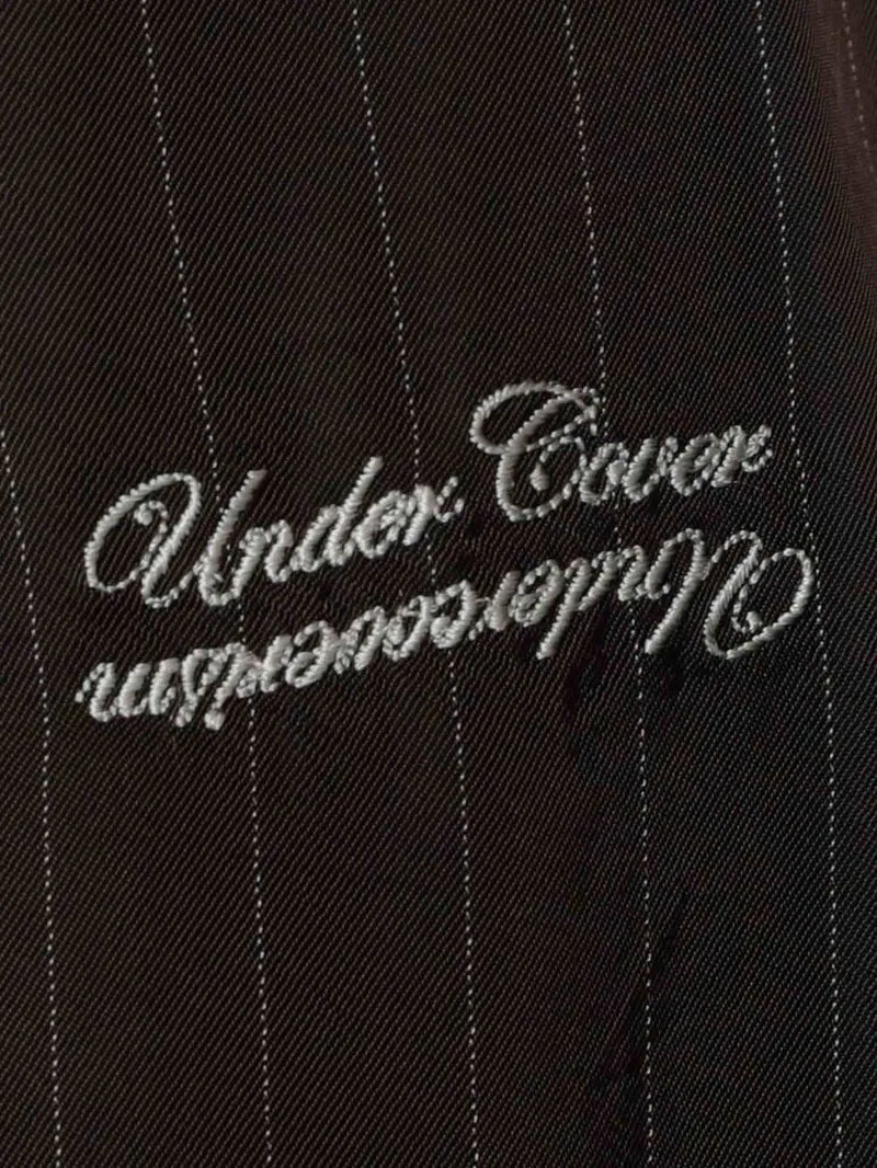Shorts marroni in cupro con motivo gessato e logo