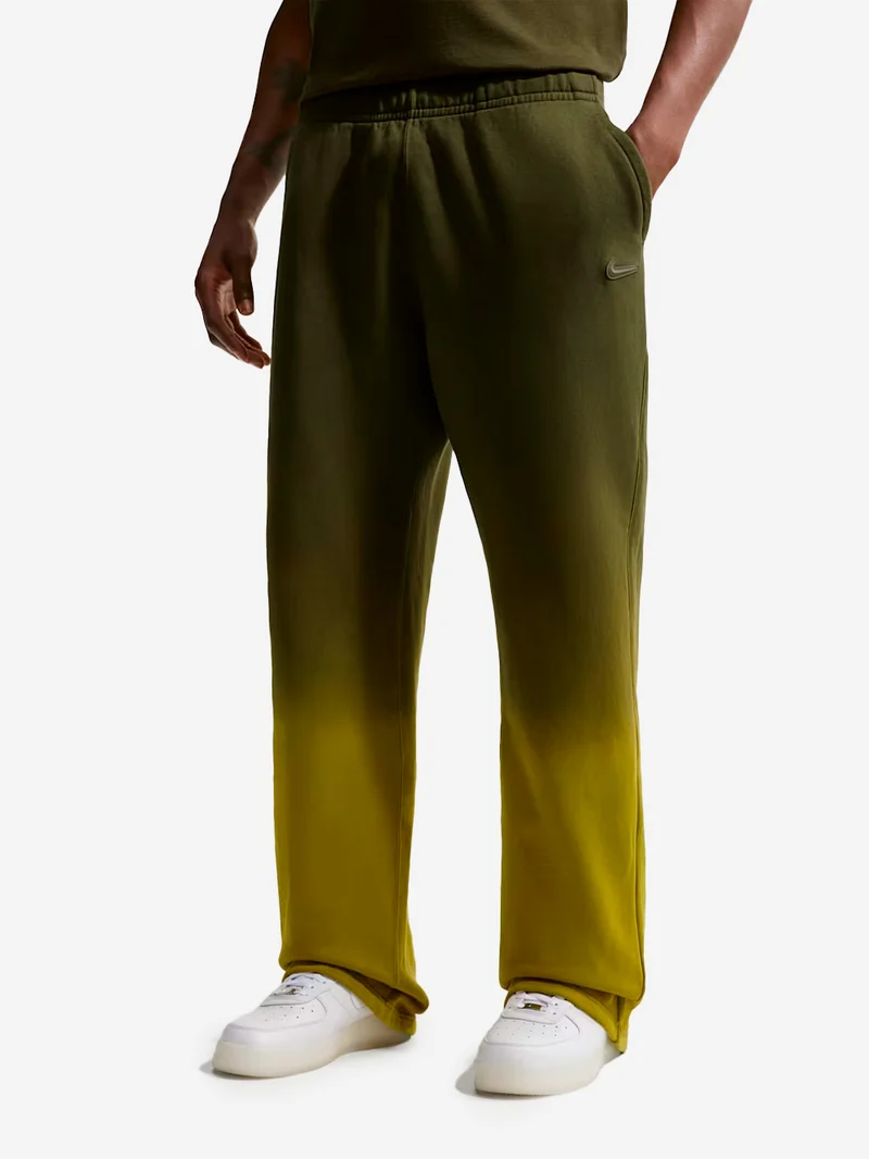 Pantaloni fleece verdi CS Nocta x Drake con bordo aperto