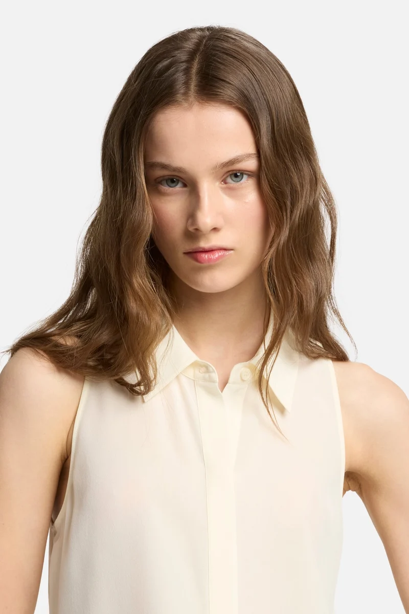 Sleeveless Silk Button Down in Ivory
