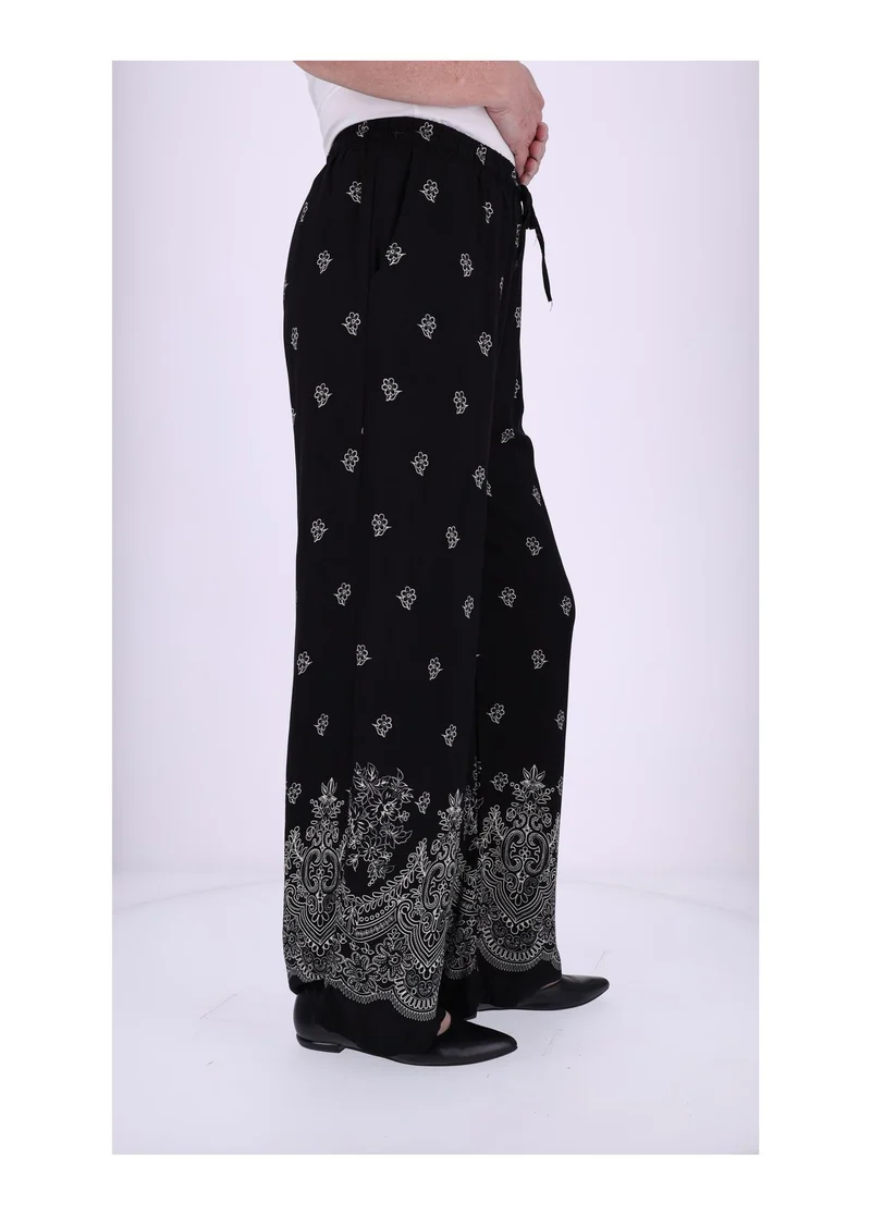 Damen Schlupfhose mit Blumenprint – Schwarz