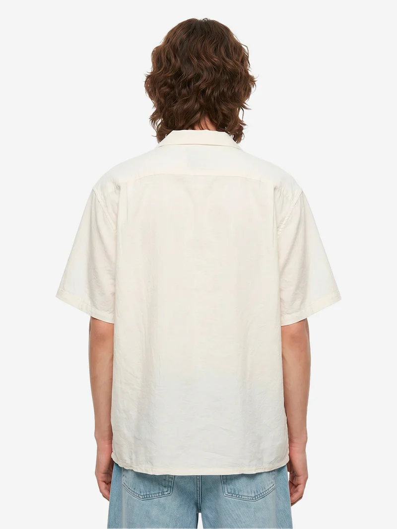 Camicia bianca a manica corta con colletto aperto in lino