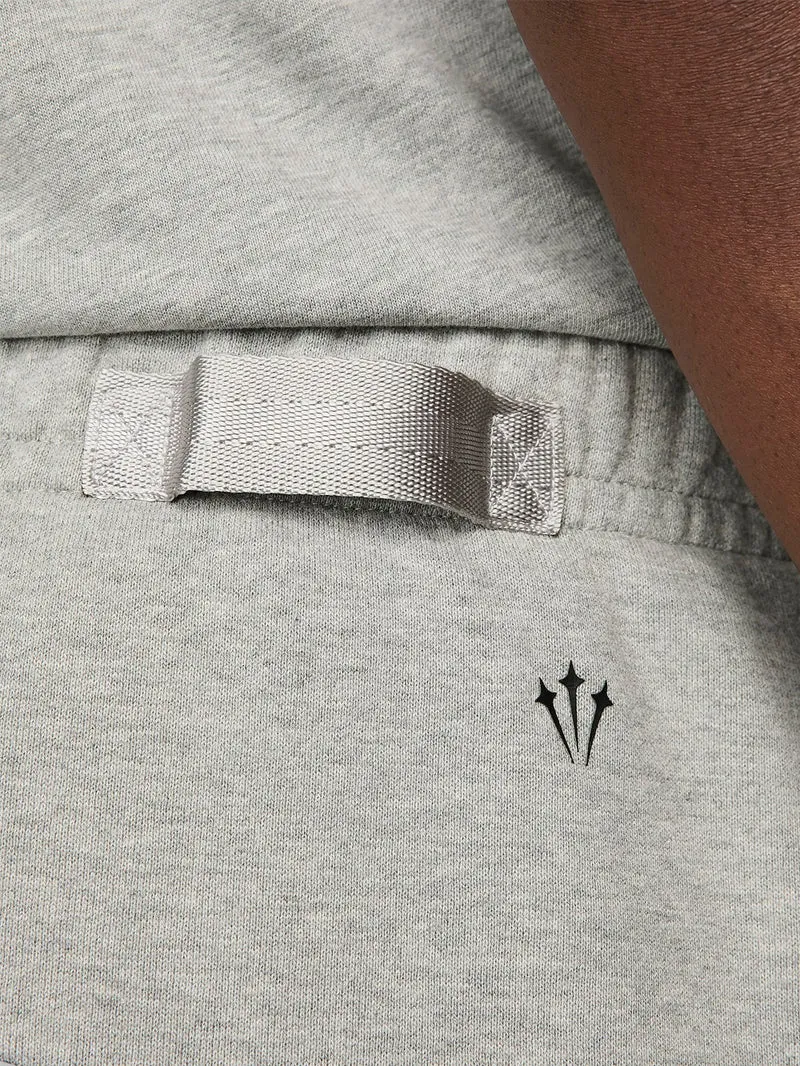 Pantaloni tuta grigi con bordo aperto CS NOCTA x Drake