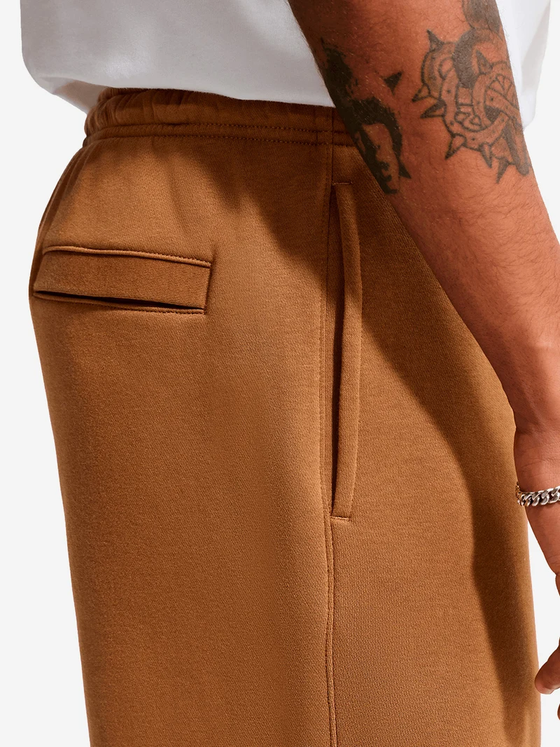 Pantaloni marroni in fleece con orlo aperto